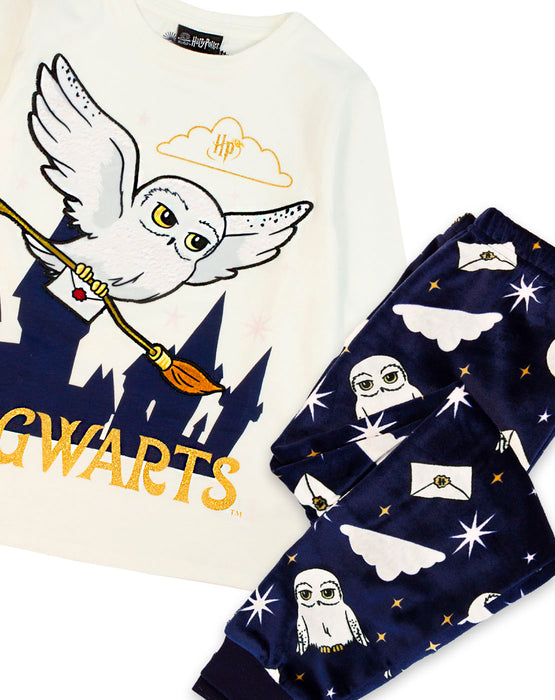 Harry Potter pyjamas for little wizards features Harry Potter's much loved pet owl, Hedwig in a fluffy texture underlined by gold glitter text reading ‘HOGWARTS’ paired perfectly with fleece legging bottoms that feature an all over print of Hedwig and the night sky making more magic at bedtime for your little ones.