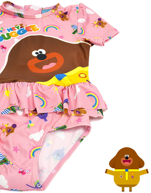 PINK HEY DUGGEE & FRIENDS SWIMSUIT SET FOR HER - Featuring the much-loved dog character Hey Duggee, the leader of The Squirrel Club contrasted against a vibrant pink swimsuit that showcases an all over print of Hey Duggee friend characters, suns and rainbows; this Hey Duggee swimming costume is adorable for toddlers and children!