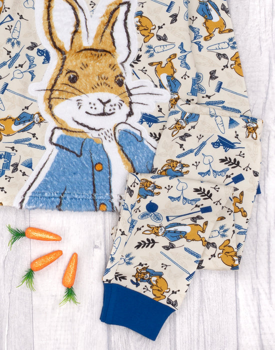 The top and bottoms feature a fluffy print showcasing Peter Rabbit surrounded by plants and carrots making a must have nightwear gift set for babies, toddlers and children!